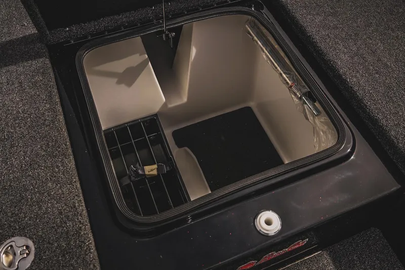 Slide: The Image of 2026 Bass Cat Cougar FTD storage compartment with organized interior layout. - 26