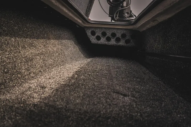 Slide: The Image of Interior view of 2026 Bass Cat Cougar FTD storage compartment with rod holders. - 28