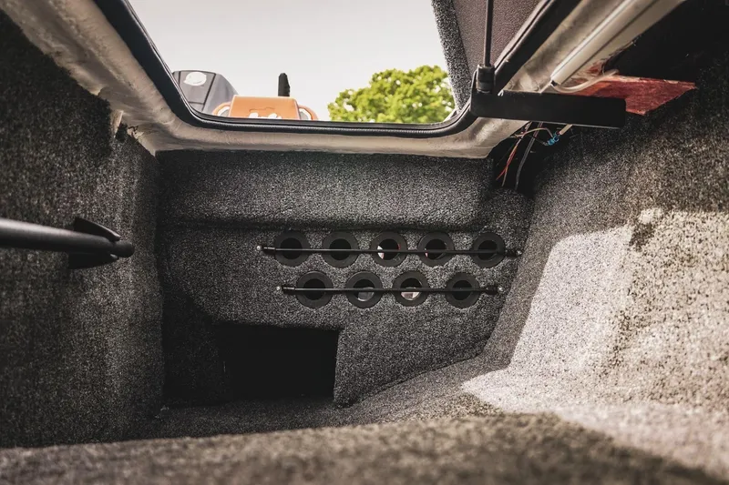 Slide: The Image of Interior view of 2026 Bass Cat Cougar FTD boat storage compartment. - 29