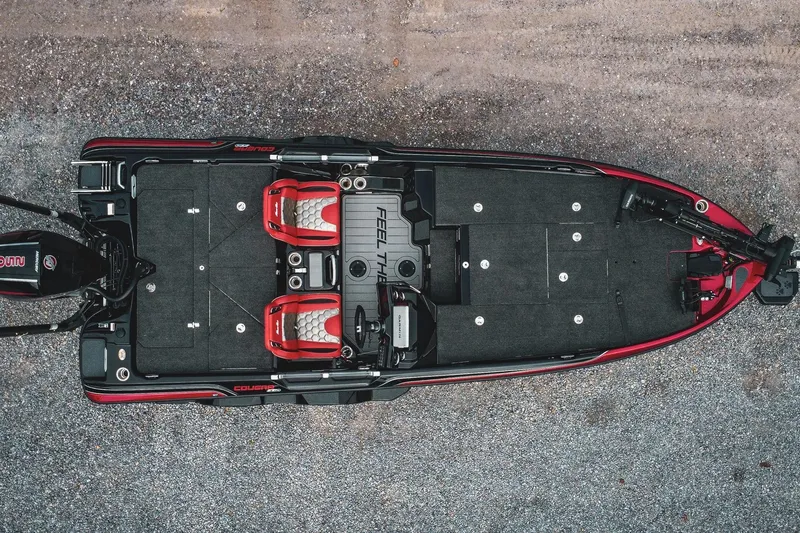 Slide: The Image of 2026 Bass Cat Cougar FTD Special Package boat, aerial view, featuring sleek design and spacious deck. - 3