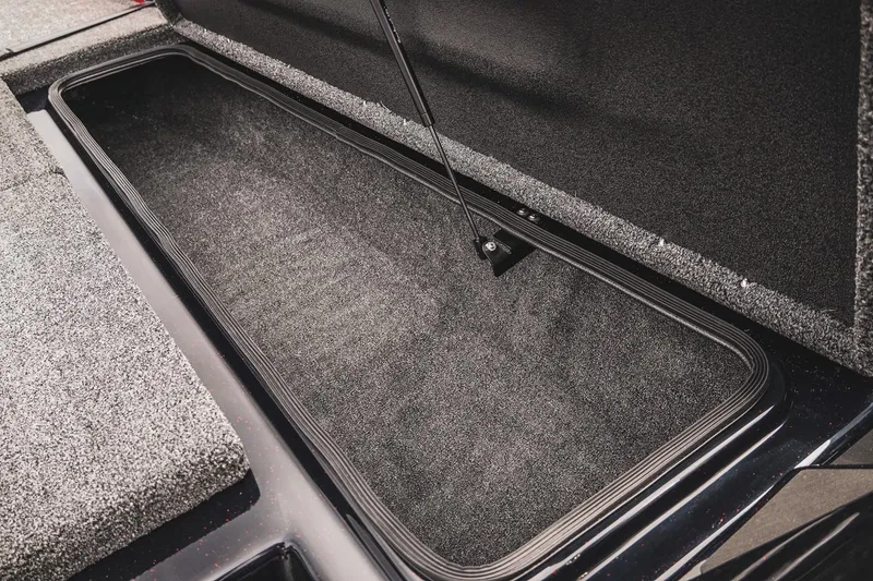 Slide: The Image of Open storage compartment in 2026 Bass Cat Cougar FTD boat, showcasing spacious interior. - 30