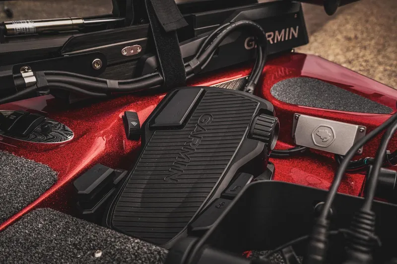Slide: The Image of Close-up of Garmin equipment on 2026 Bass Cat Cougar FTD boat, featuring red metallic finish. - 32