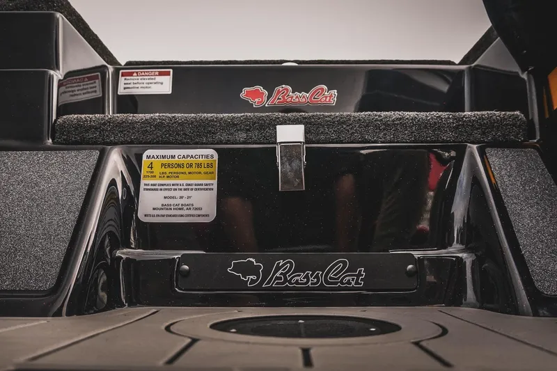 Slide: The Image of 2026 Bass Cat Cougar FTD boat interior, showcasing capacity label and branding details. - 34