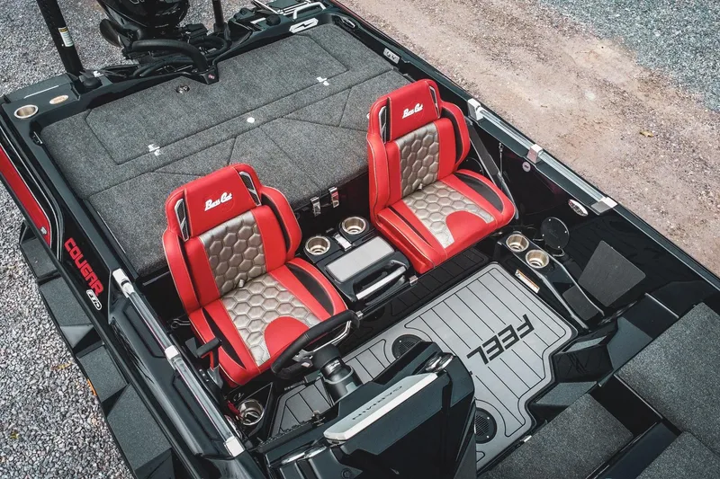 Slide: The Image of 2026 Bass Cat Cougar FTD boat interior with red and gray seats, sleek design, and modern features. - 4