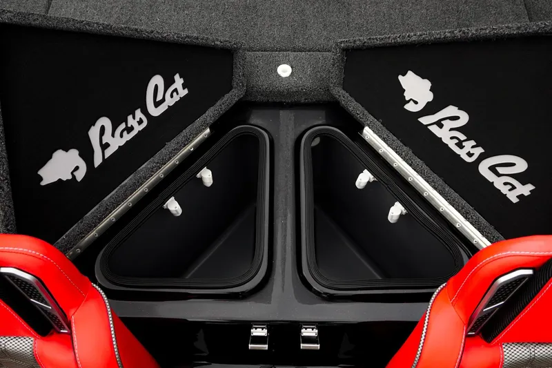 Slide: The Image of 2026 Bass Cat Cougar FTD boat interior with storage compartments and red seats. - 40