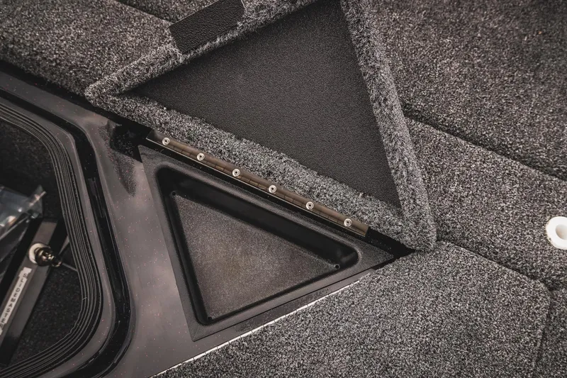 Slide: The Image of 2026 Bass Cat Cougar FTD boat storage compartment with open lid, showcasing interior design. - 43