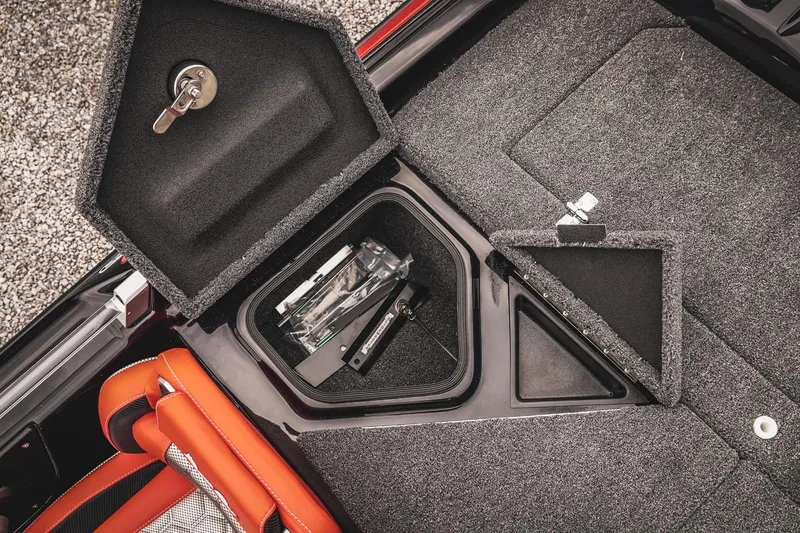 Slide: The Image of 2026 Bass Cat Cougar FTD storage compartment with open hatch and visible interior. - 44