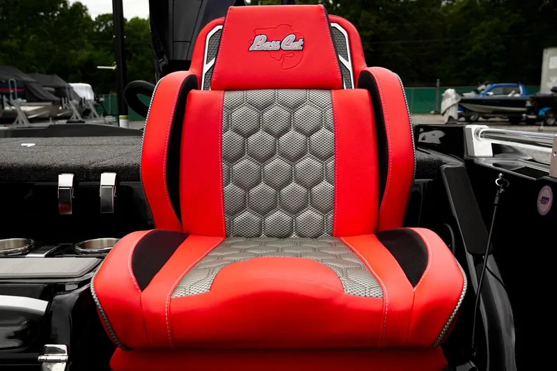 Slide: The Image of Red and gray seat of 2026 Bass Cat Cougar FTD boat, featuring hexagonal pattern design. - 47