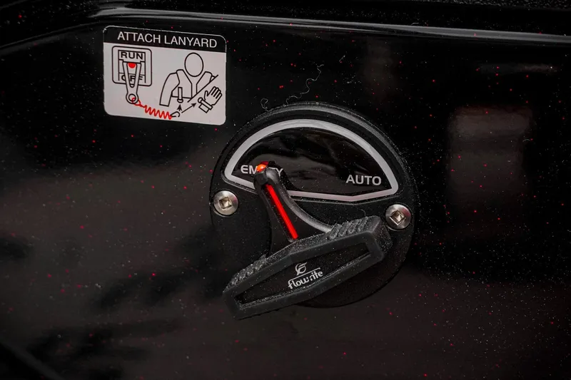 Slide: The Image of 2026 Bass Cat Cougar FTD control panel with lanyard attachment and Flow-Rite switch. - 48