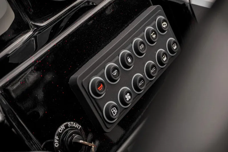 Slide: The Image of Dashboard controls of 2026 Bass Cat Cougar FTD Special Package boat. - 49