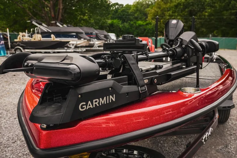 Slide: The Image of 2026 Bass Cat Cougar FTD boat with Garmin equipment, parked outdoors. - 51