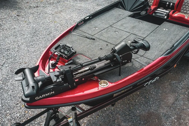 Slide: The Image of 2026 Bass Cat Cougar FTD boat with Garmin equipment on a gravel surface. - 54