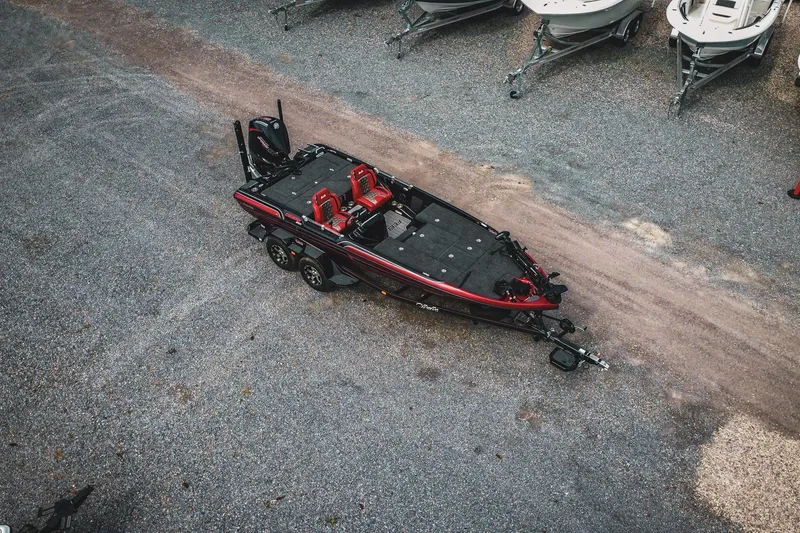 Slide: The Image of 2026 Bass Cat Cougar FTD Special Package boat on gravel lot, aerial view. - 56
