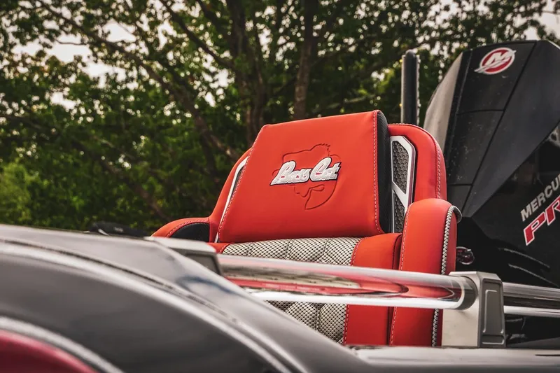 Slide: The Image of 2026 Bass Cat Cougar FTD boat seat with logo, featuring vibrant red upholstery. - 7