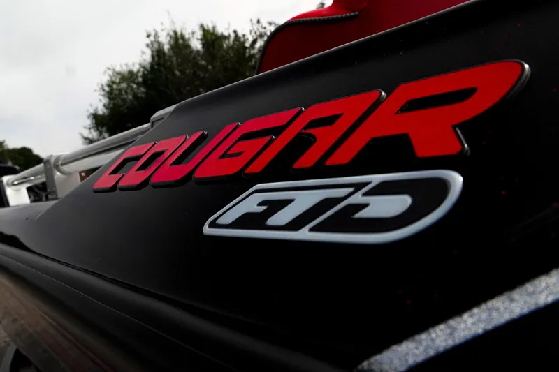 Slide: The Image of 2026 Bass Cat Cougar FTD Special Package logo on sleek black surface. - 9