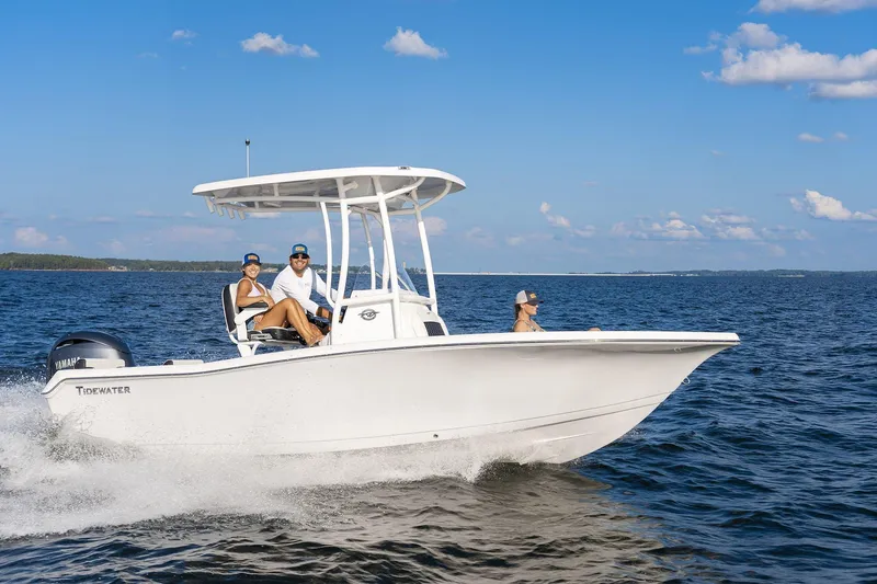 Slide: The Image of 2026 Tidewater 198 CC Adventure boat cruising on open water under clear blue skies. - 3