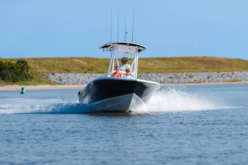 Slide: The Image of 2026 Tidewater 198 CC Adventure boat cruising on open water. - 7