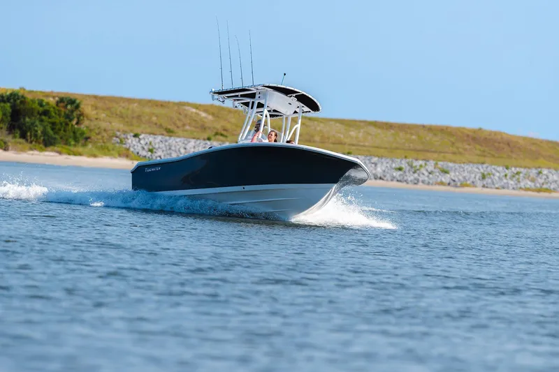 Slide: The Image of 2026 Tidewater 198 CC Adventure boat cruising on open water. - 8