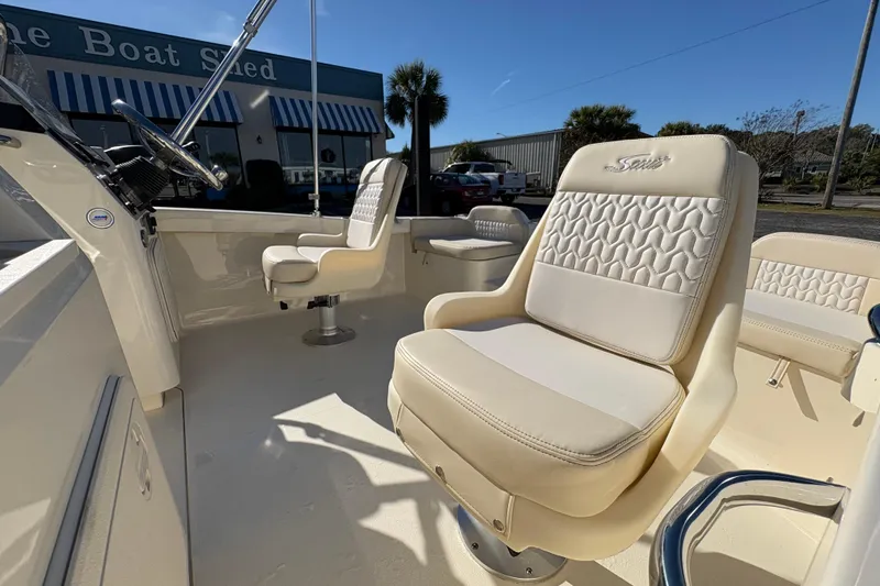 Slide: The Image of 2026 Scout 188 Sport Dorado boat interior with control panel and storage compartments. - 10