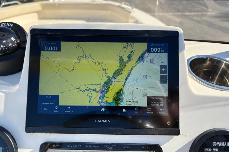 Slide: The Image of Control panel of 2026 Scout 188 Sport Dorado boat with SeaStar and Fusion systems. - 13