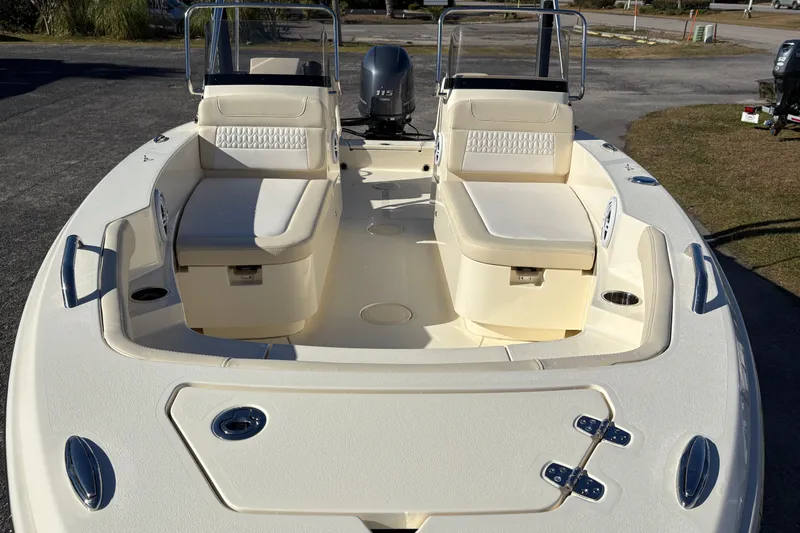 Slide: The Image of 2026 Scout 188 Sport Dorado boat interior with open storage compartment and speakers. - 17