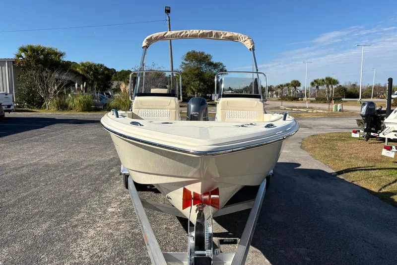 Slide: The Image of 2026 Scout 188 Sport Dorado boat on trailer, parked outdoors under clear sky. - 7