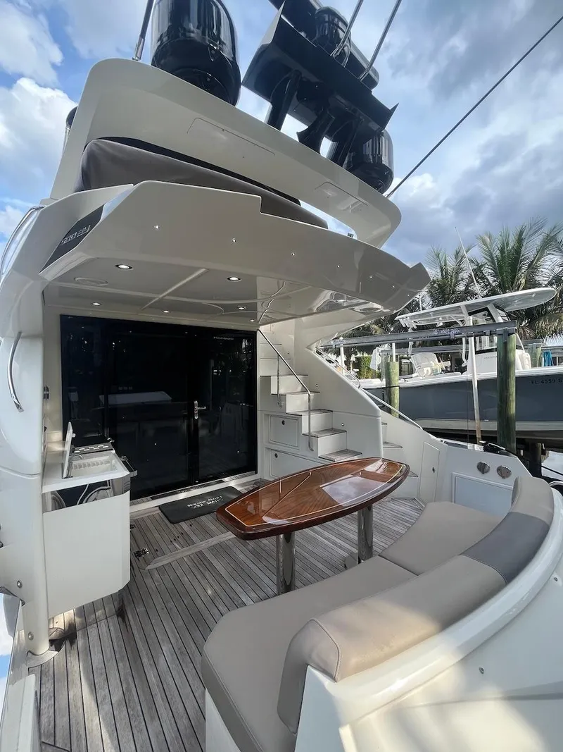 Slide: The Image of 2017 Marquis 500 Sport Yacht with outdoor seating and table. - 20