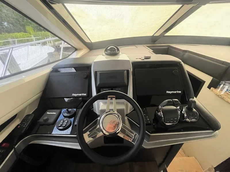 Slide: The Image of Helm of 2017 Marquis 500 Sport Yacht with Raymarine electronics. - 32