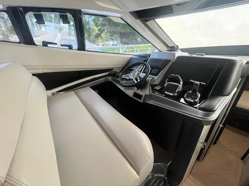 Slide: The Image of Interior helm of 2017 Marquis 500 Sport Yacht with modern controls and steering wheel. - 33