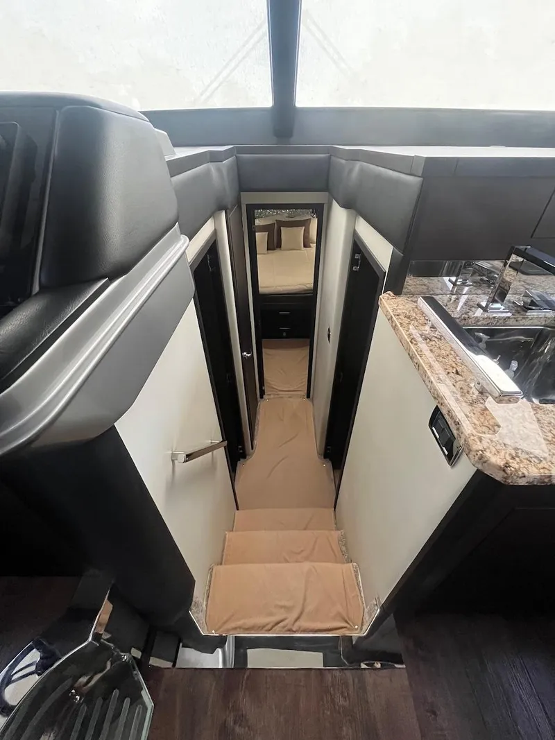 Slide: The Image of 2017 Marquis 500 Sport Yacht interior with stairs and modern design. - 35