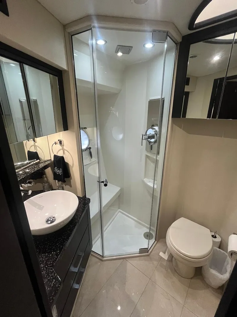 Slide: The Image of 2017 Marquis 500 Sport Yacht bathroom with modern shower and sink. - 37