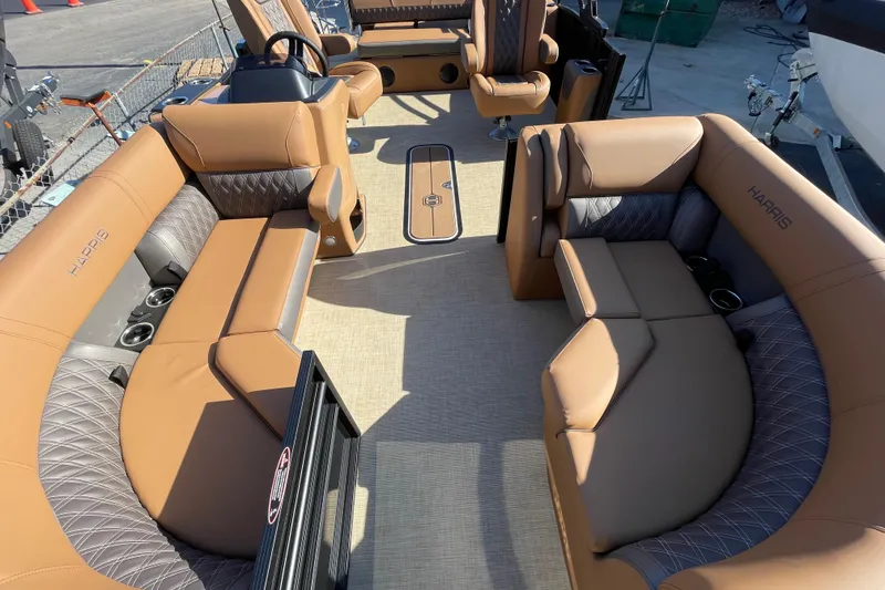 Slide: The Image of 2026 Harris Cruiser 210 pontoon boat interior with tan seating and modern design. - 14
