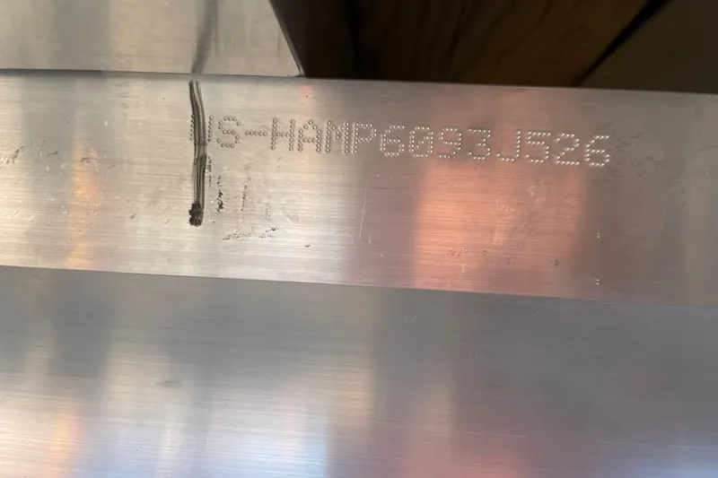 Slide: The Image of Serial number on 2026 Harris Cruiser 210 metal surface. - 21