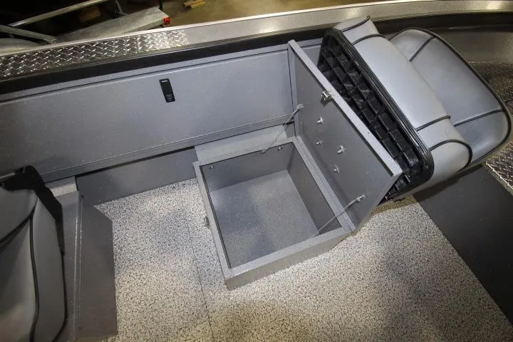 Slide: The Image of 2026 Alumaweld Columbia 21 boat interior with open storage compartment and seating. - 11