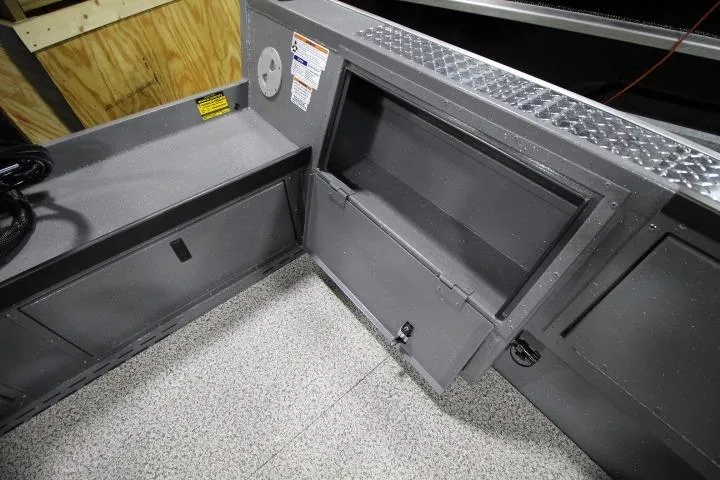 Slide: The Image of Interior of 2026 Alumaweld Columbia 21 boat showing storage compartments and non-slip flooring. - 14