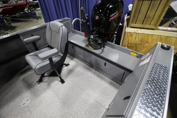 Slide: The Image of 2026 Alumaweld Columbia 21 boat interior with seating and motor, showcasing modern design. - 3