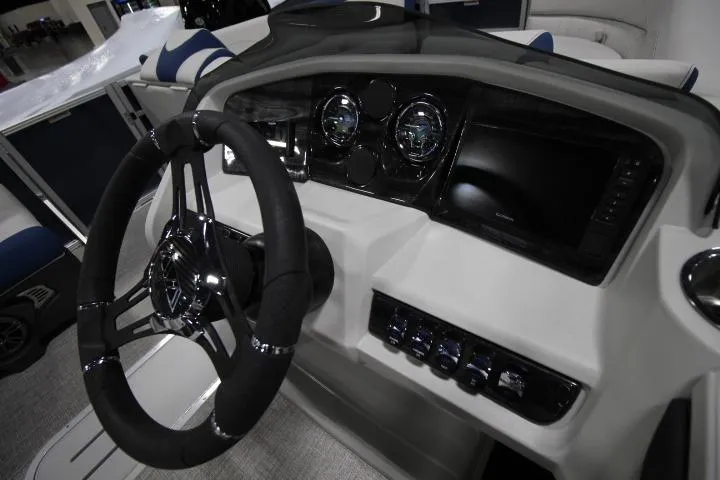 Slide: The Image of 2026 Avalon LSZ Rear Fish boat dashboard with steering wheel and control panel. - 11