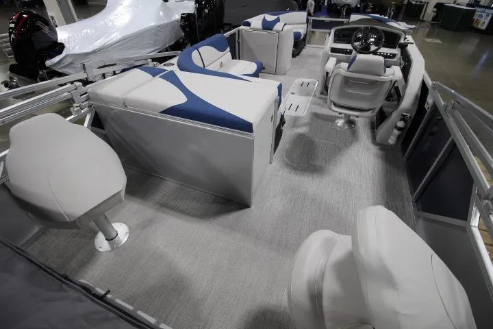 Slide: The Image of 2026 Avalon LSZ Rear Fish pontoon boat interior with modern seating and steering console. - 4