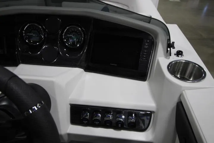 Slide: The Image of Dashboard of 2026 Avalon LSZ Rear Fish boat with gauges and controls. - 9