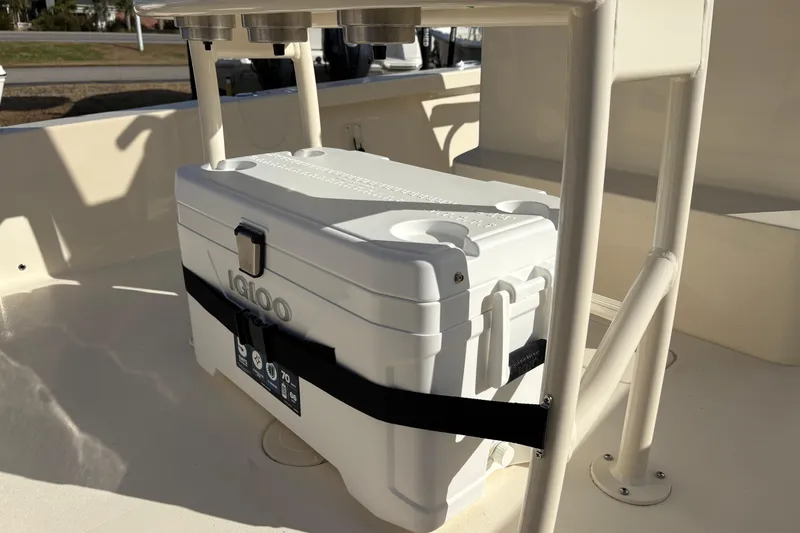 Slide: The Image of 2026 Scout 231 XSB boat with secured Igloo cooler on deck. - 13