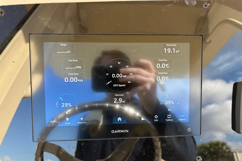Slide: The Image of Garmin display on 2026 Scout 231 XSB boat showing fuel and speed data. - 16