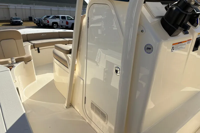 Slide: The Image of 2026 Scout 231 XSB boat interior with seating and control panel. - 20