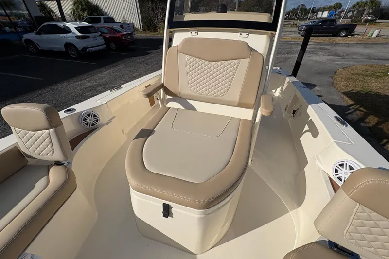 Slide: The Image of 2026 Scout 231 XSB boat interior with beige seating and modern design. - 23