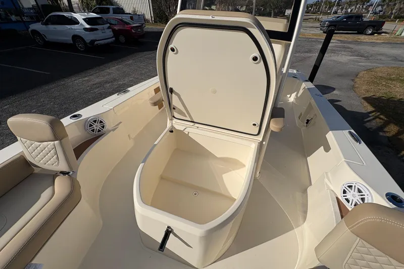 Slide: The Image of 2026 Scout 231 XSB boat interior with open storage compartment. - 24