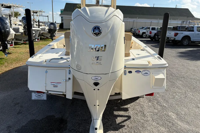 Slide: The Image of 2026 Scout 231 XSB boat with powerful 300 V6 engine, parked outdoors. - 3