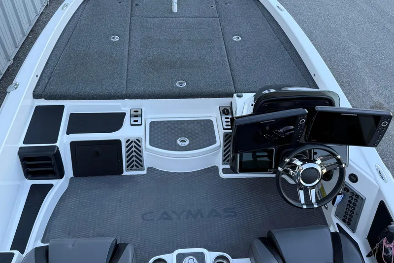 Slide: The Image of 2022 Caymas CX 20 PRO boat interior with dual screens and steering wheel. - 11
