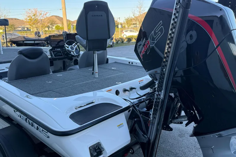 Slide: The Image of 2022 Caymas CX 20 PRO boat with Mercury engine, featuring spacious deck and modern controls. - 5