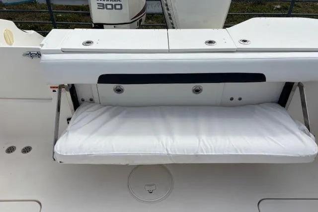Slide: The Image of 2013 Wellcraft 30 Scarab Sport boat interior with seating and console. - 13