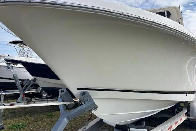 Slide: The Image of 2013 Wellcraft 30 Scarab Sport boat interior, featuring spacious seating and sleek design. - 14