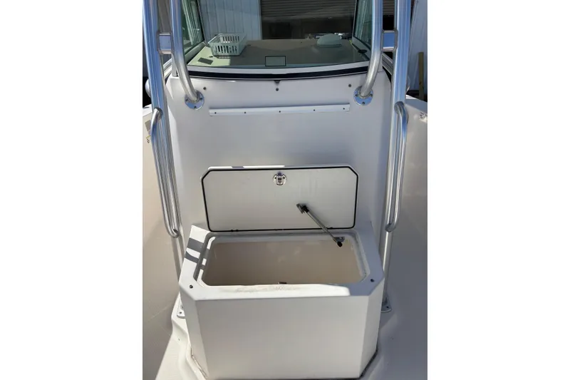 Slide: The Image of 2013 Wellcraft 30 Scarab Sport boat storage compartment with open hatch and stainless steel rails. - 17